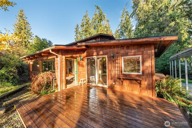 a porch with seating space and yard in the back