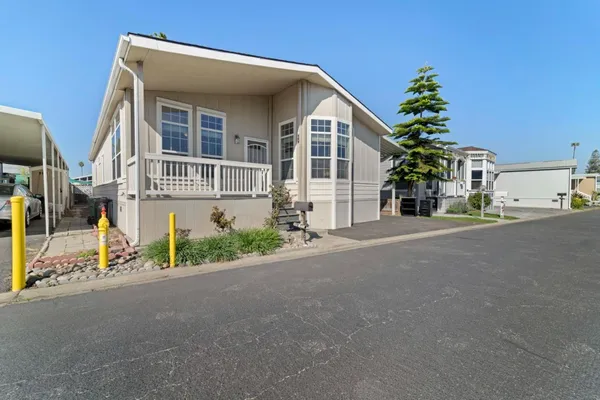 a view of a house with a street