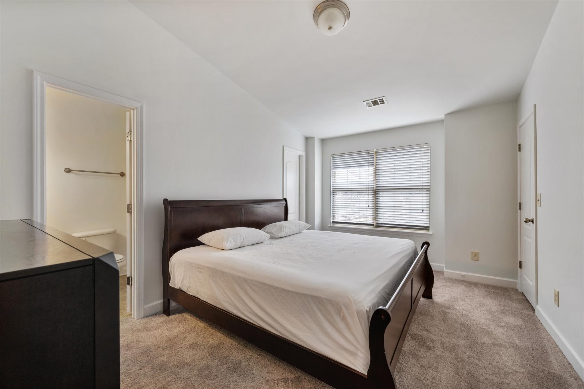 735 Tulip Grove Road, Unit 311 Hermitage, TN 37076 - Photo 11 of 23 a bedroom with a bed and a window