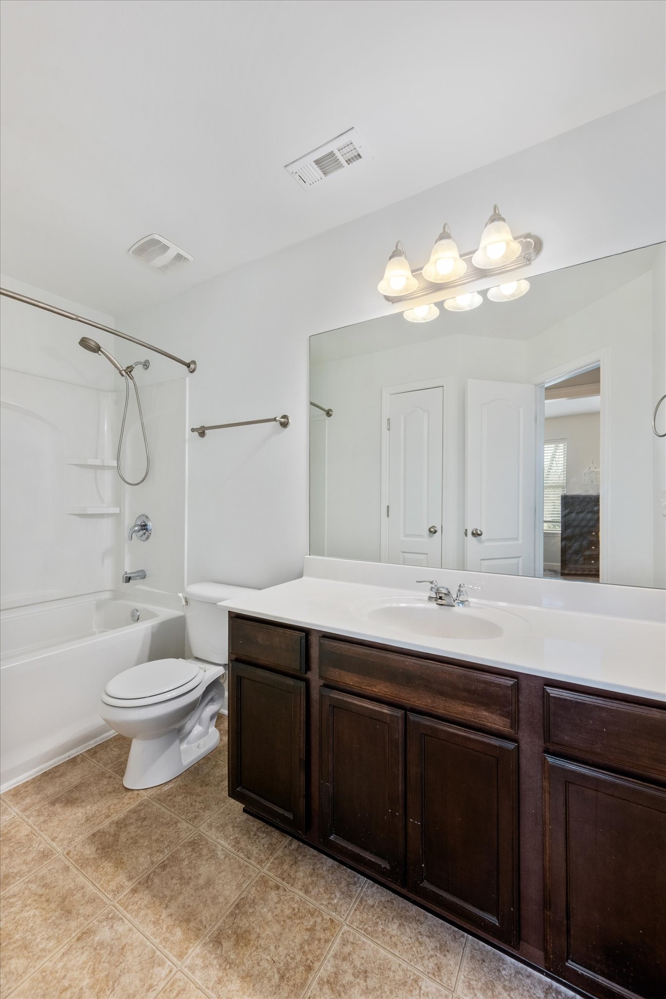 735 Tulip Grove Road, Unit 311 Hermitage, TN 37076 - Photo 20 of 23 a bathroom with a toilet a sink and bathtub