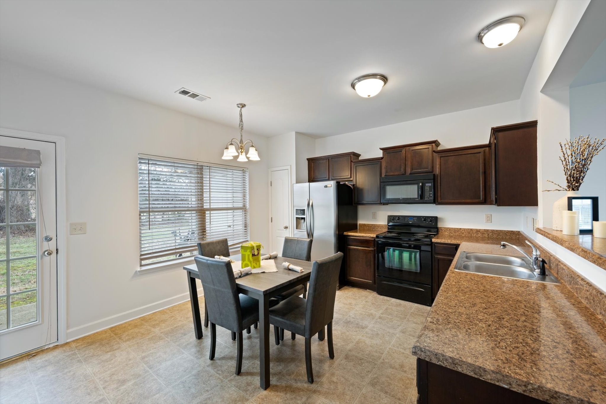 735 Tulip Grove Road, Unit 311 Hermitage, TN 37076 - Photo 6 of 23 a view of a dining room with furniture