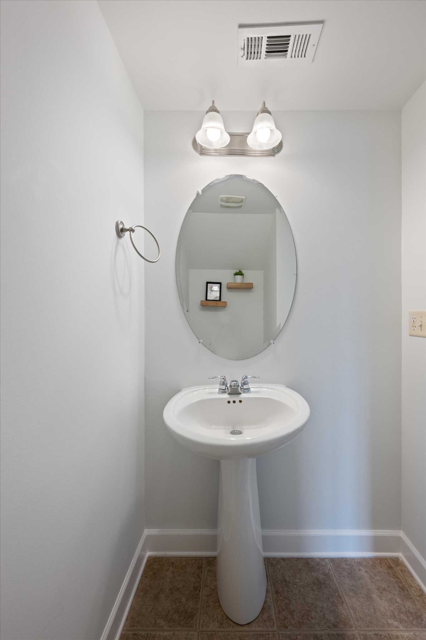 735 Tulip Grove Road, Unit 311 Hermitage, TN 37076 - Photo 10 of 23 a bathroom with a sink and a mirror