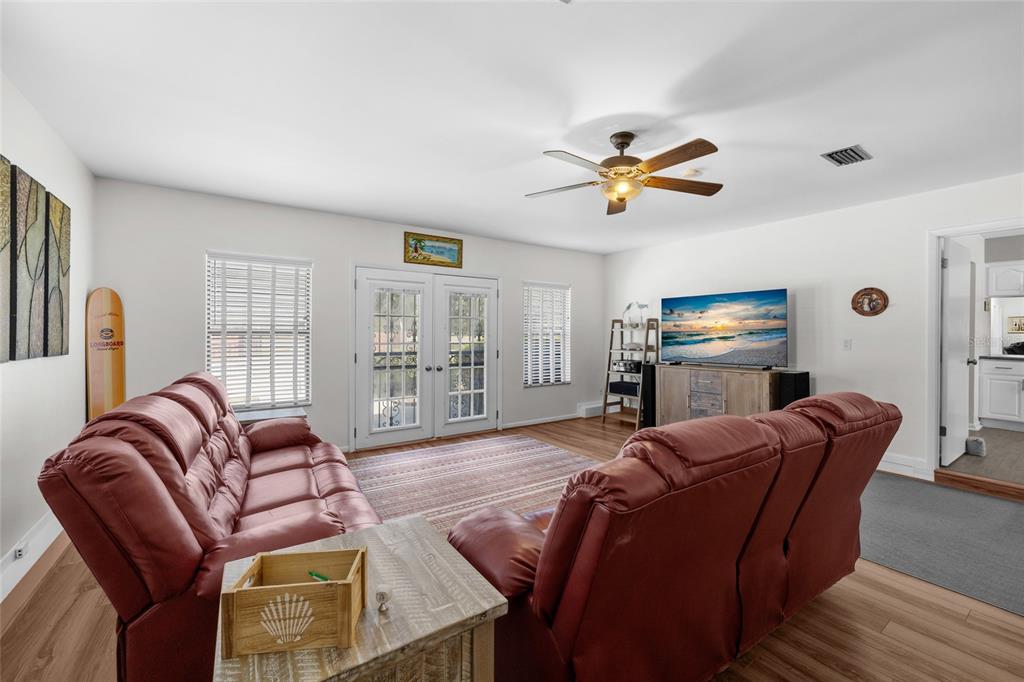 3012 Southeast Country Club Road Lake City, FL 32025 - Photo 16 of 41 a living room with furniture ceiling fan and a window