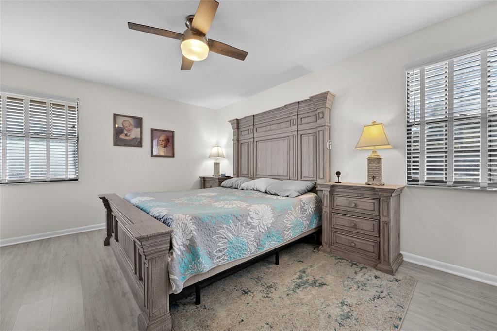 3012 Southeast Country Club Road Lake City, FL 32025 - Photo 18 of 41 a bedroom with a bed and a chandelier