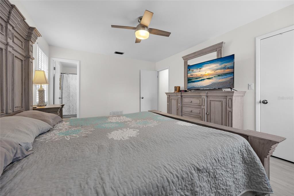 3012 Southeast Country Club Road Lake City, FL 32025 - Photo 19 of 41 a bedroom with a bed and a flat screen tv