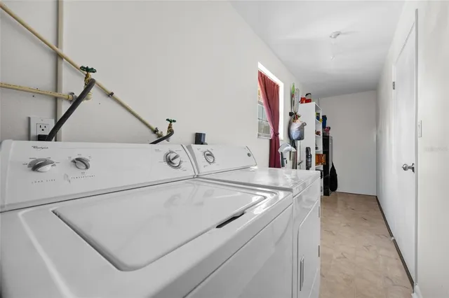 a utility room with dryer and washer