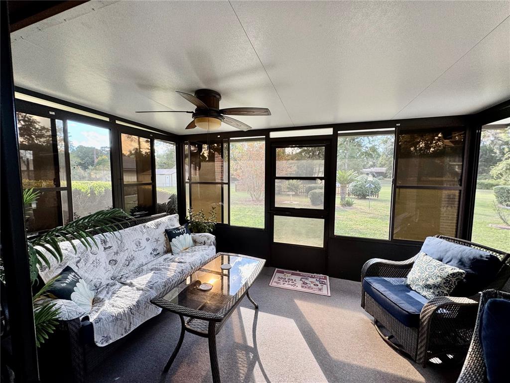 3012 Southeast Country Club Road Lake City, FL 32025 - Photo 28 of 41 a living room with furniture and a large window