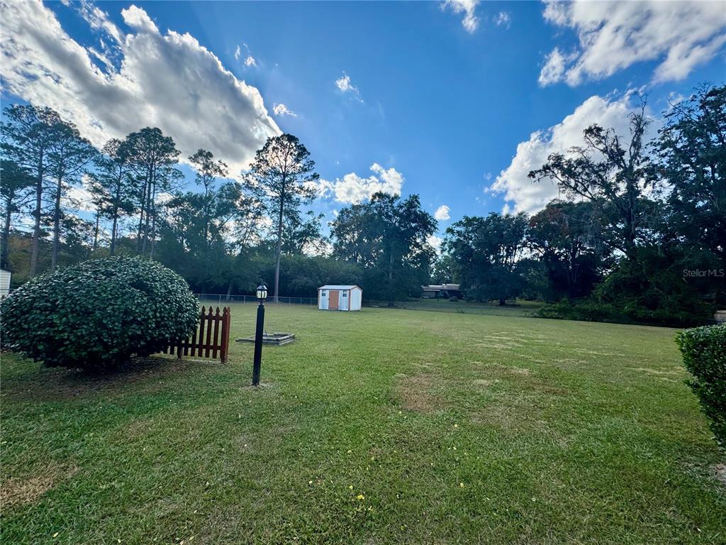 3012 Southeast Country Club Road Lake City, FL 32025 - Photo 29 of 41 a view of a backyard with garden