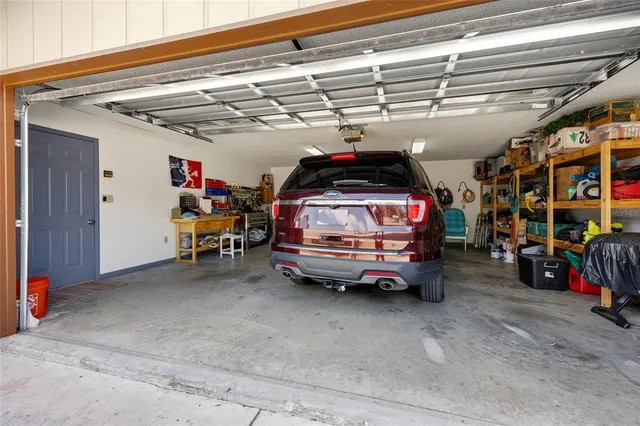 a view of parking garage with cars