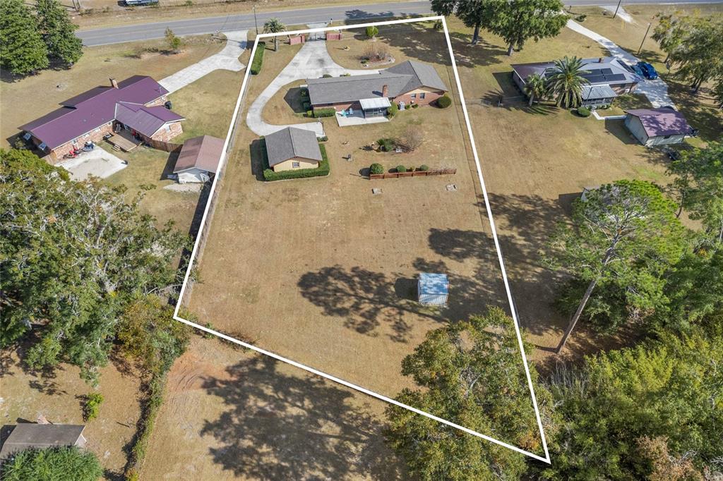 3012 Southeast Country Club Road Lake City, FL 32025 - Photo 36 of 41 an aerial view of a house with a yard