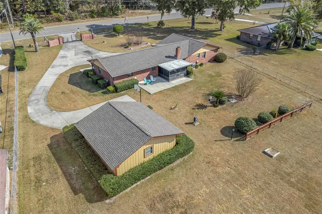 an aerial view of a house with outdoor space