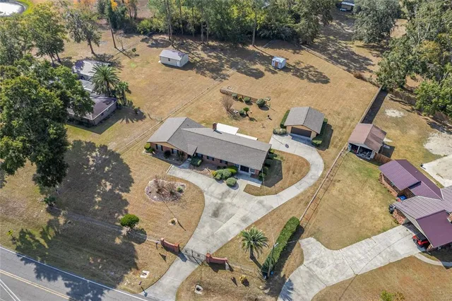 an aerial view of a house with outdoor space