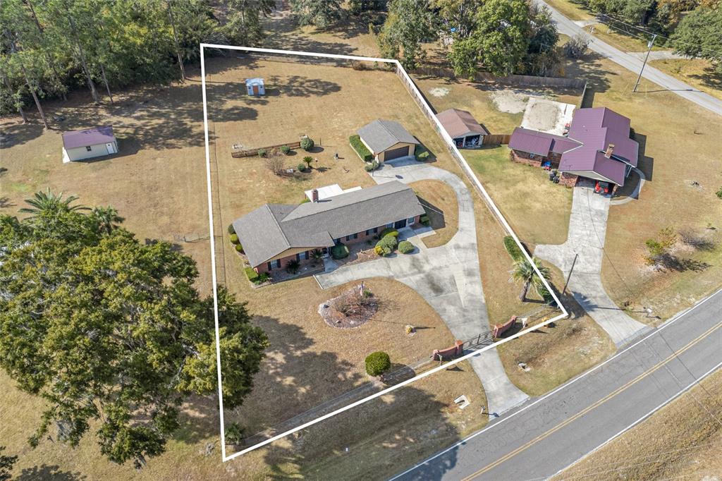3012 Southeast Country Club Road Lake City, FL 32025 - Photo 4 of 41 a view of roof deck with table and chairs