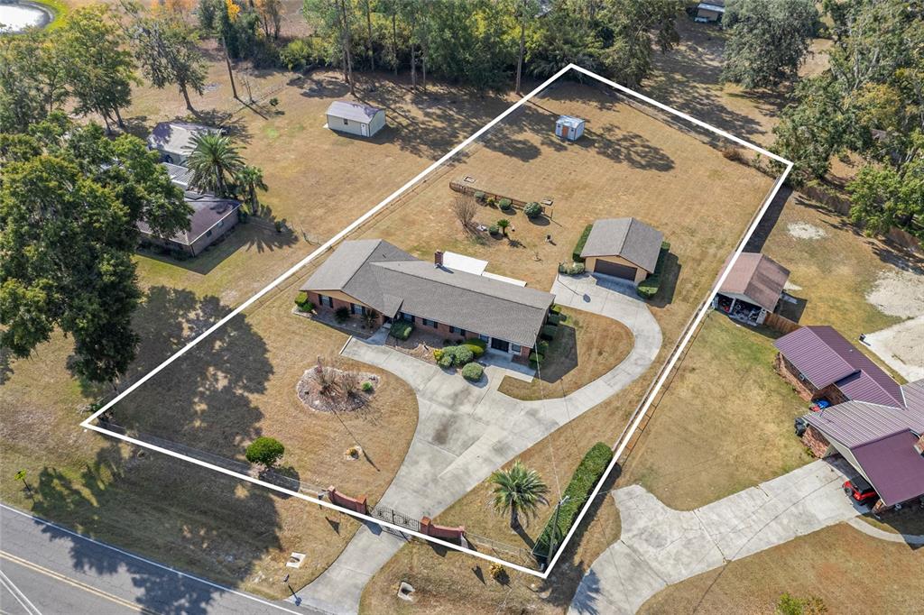 3012 Southeast Country Club Road Lake City, FL 32025 - Photo 41 of 41 a house with trees in front of it