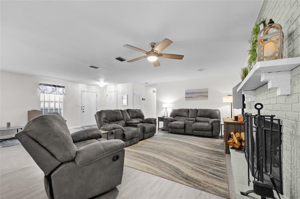 3012 Southeast Country Club Road Lake City, FL 32025 - Photo 7 of 41 a living room with furniture ceiling fan and a window