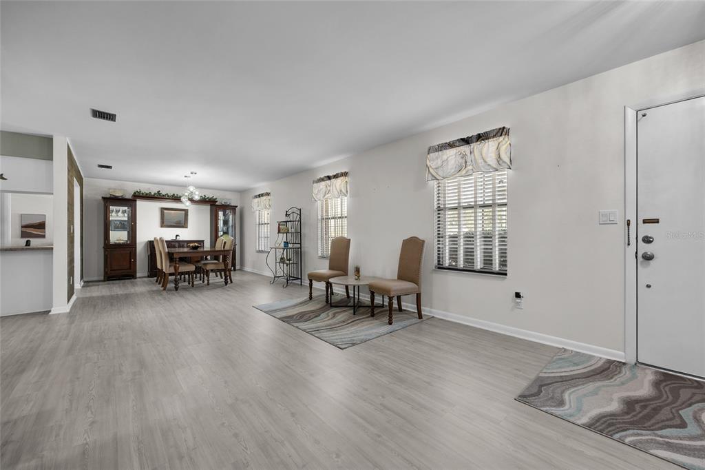 3012 Southeast Country Club Road Lake City, FL 32025 - Photo 8 of 41 a living room with furniture and a wooden floor