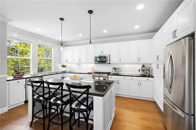 a bedroom with a bed and a window with lamp