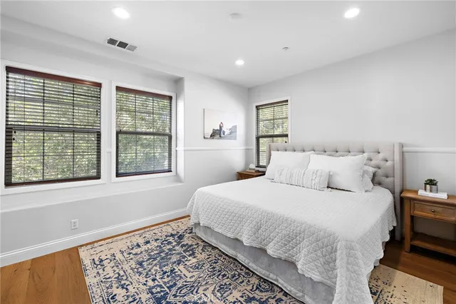 a bed room with a rug and a rug