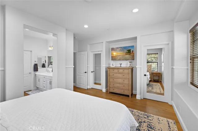a bathroom with a sink mirror vanity and toilet