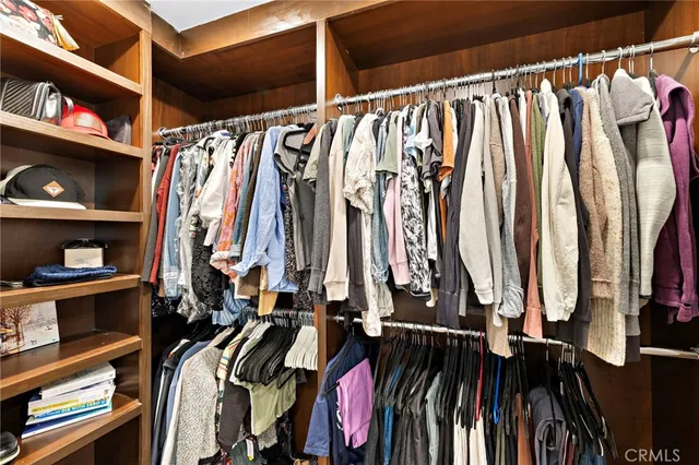 a view of a house with a small yard and flower plants
