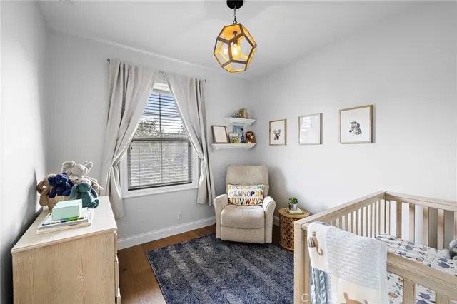an aerial view of a house with a swimming pool and outdoor seating