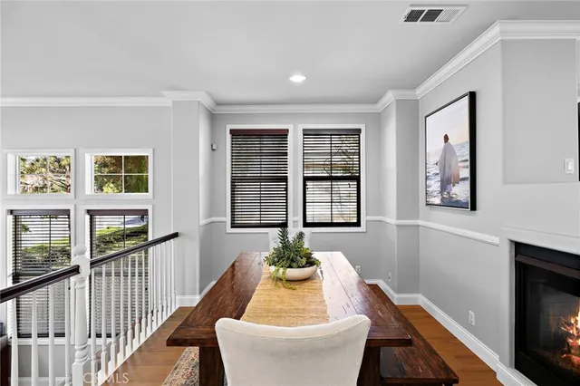 a living room with furniture a window and a chandelier
