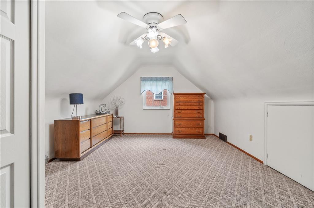 239 Roberts Road Pittsburgh, PA 15239 - Photo 15 of 30 a view of a livingroom with a chandelier fan and windows