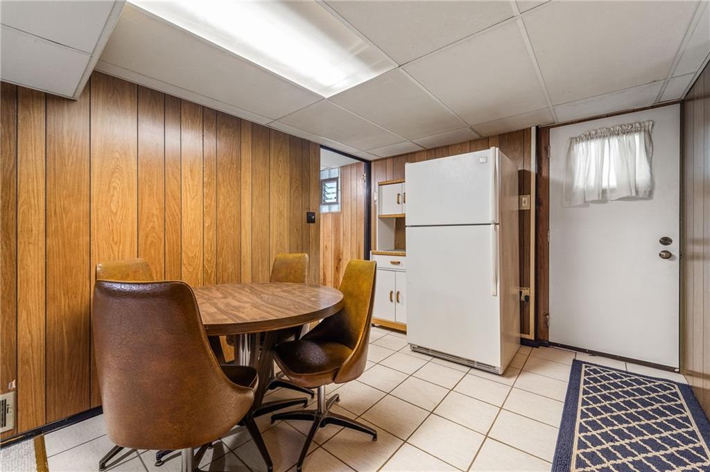 239 Roberts Road Pittsburgh, PA 15239 - Photo 19 of 30 a room with furniture and a refrigerator