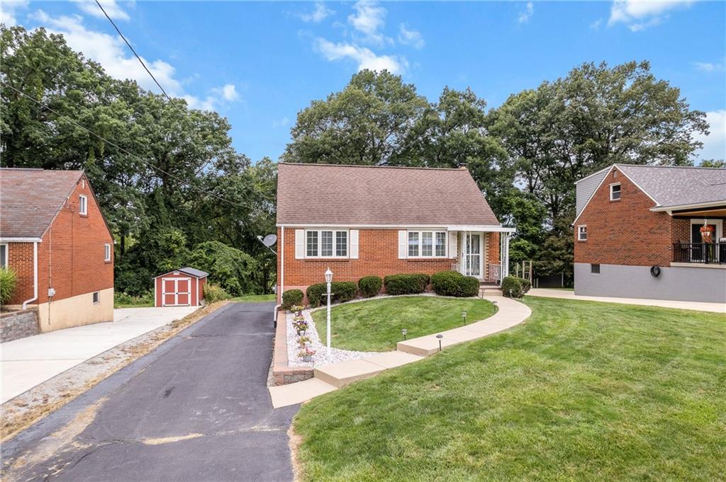239 Roberts Road Pittsburgh, PA 15239 - Photo 29 of 30 front view of a house with a yard