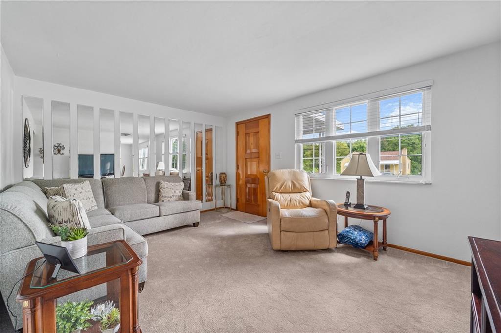 239 Roberts Road Pittsburgh, PA 15239 - Photo 5 of 30 a living room with furniture and a large window