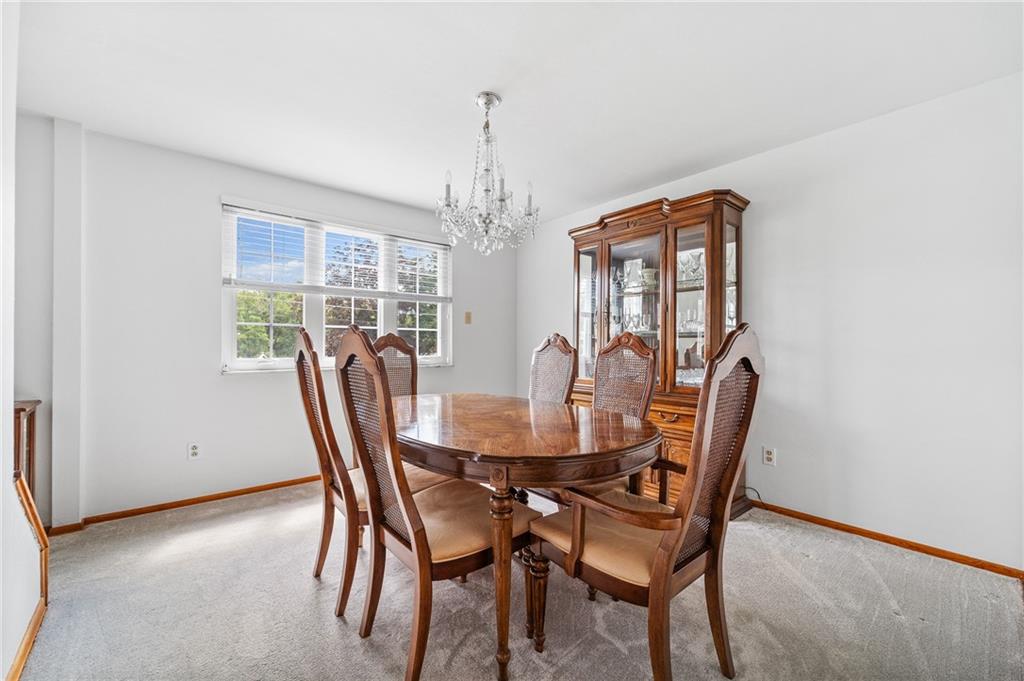 239 Roberts Road Pittsburgh, PA 15239 - Photo 8 of 30 a view of a dining room with furniture window and outside view