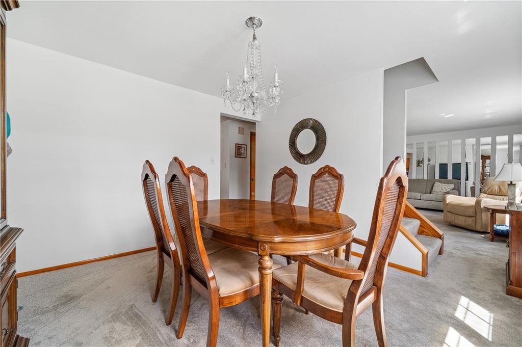 239 Roberts Road Pittsburgh, PA 15239 - Photo 9 of 30 a dining room with furniture and a clock