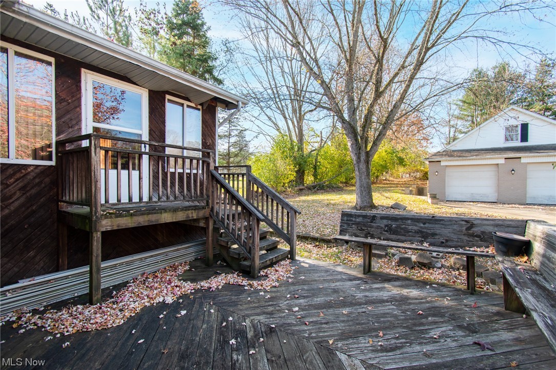6038 Tippecanoe Road Canfield, OH 44406 - Photo 28 of 34 Wooden deck with a garage