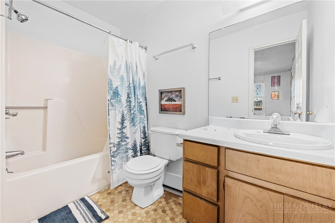 200 Pilgrims Way, Unit 12 Boone, NC 28607 - Photo 18 of 21 a bathroom with a sink toilet and shower