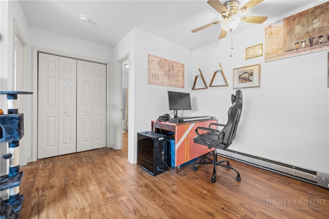 200 Pilgrims Way, Unit 12 Boone, NC 28607 - Photo 7 of 21 a view of a workspace with furniture and wooden floor