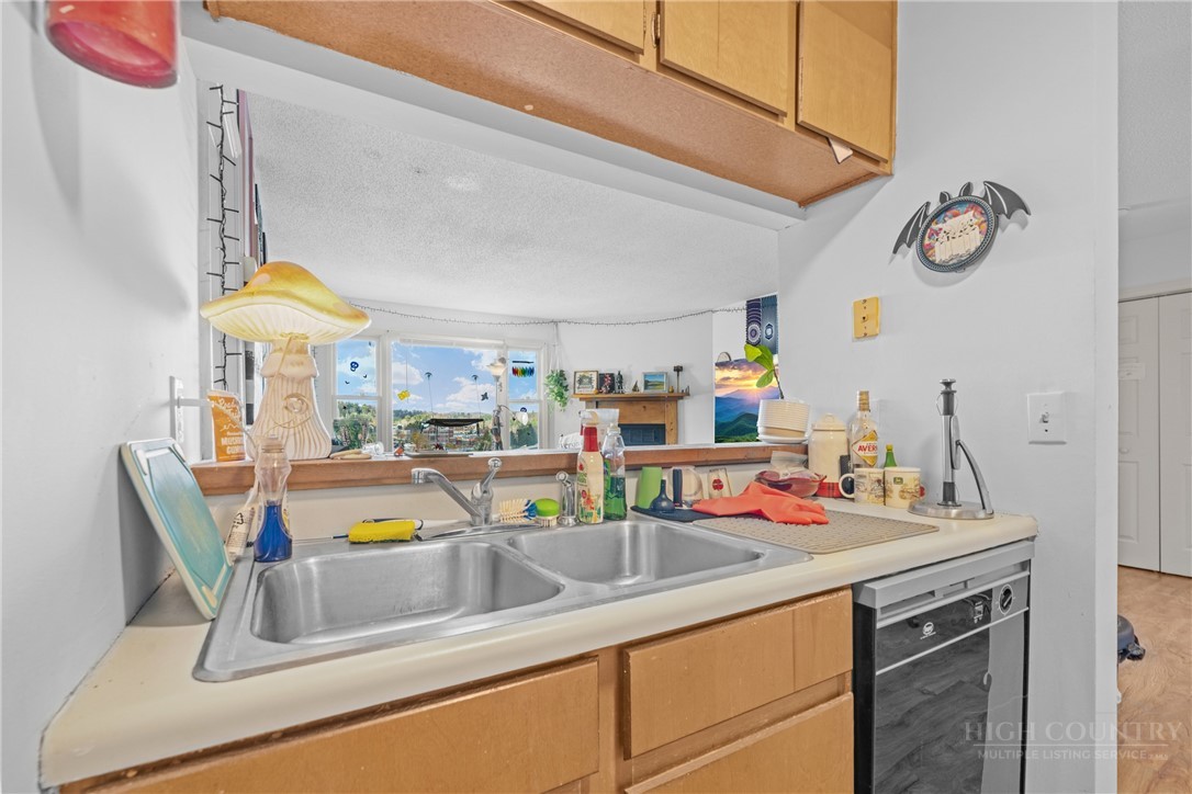 200 Pilgrims Way, Unit 12 Boone, NC 28607 - Photo 10 of 21 a kitchen with a sink and a refrigerator