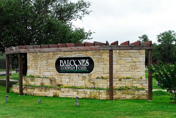 8608 Crest Ridge Circle Austin, TX 78750 - Photo 37 of 38 A welcoming stone monument with lush landscaping signals the entrance to a distinguished country club.