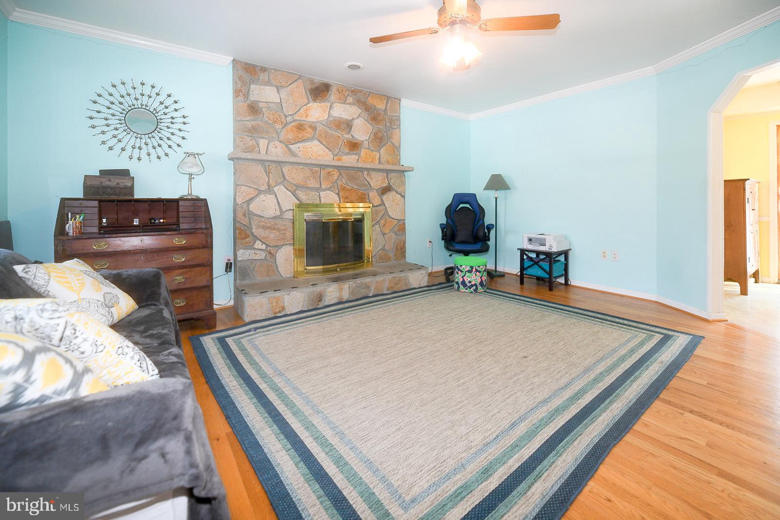 8555 Ridge Court Waldorf, MD 20603 - Photo 17 of 39 Cozy living space with stone fireplace charm.