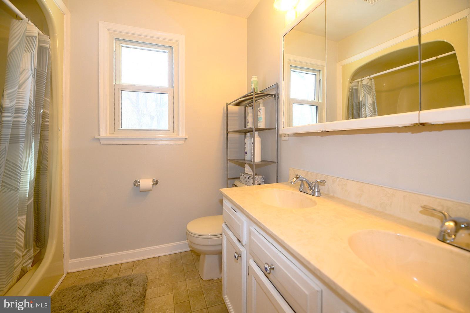 8555 Ridge Court Waldorf, MD 20603 - Photo 20 of 39 Bright and airy bathroom with modern touches.