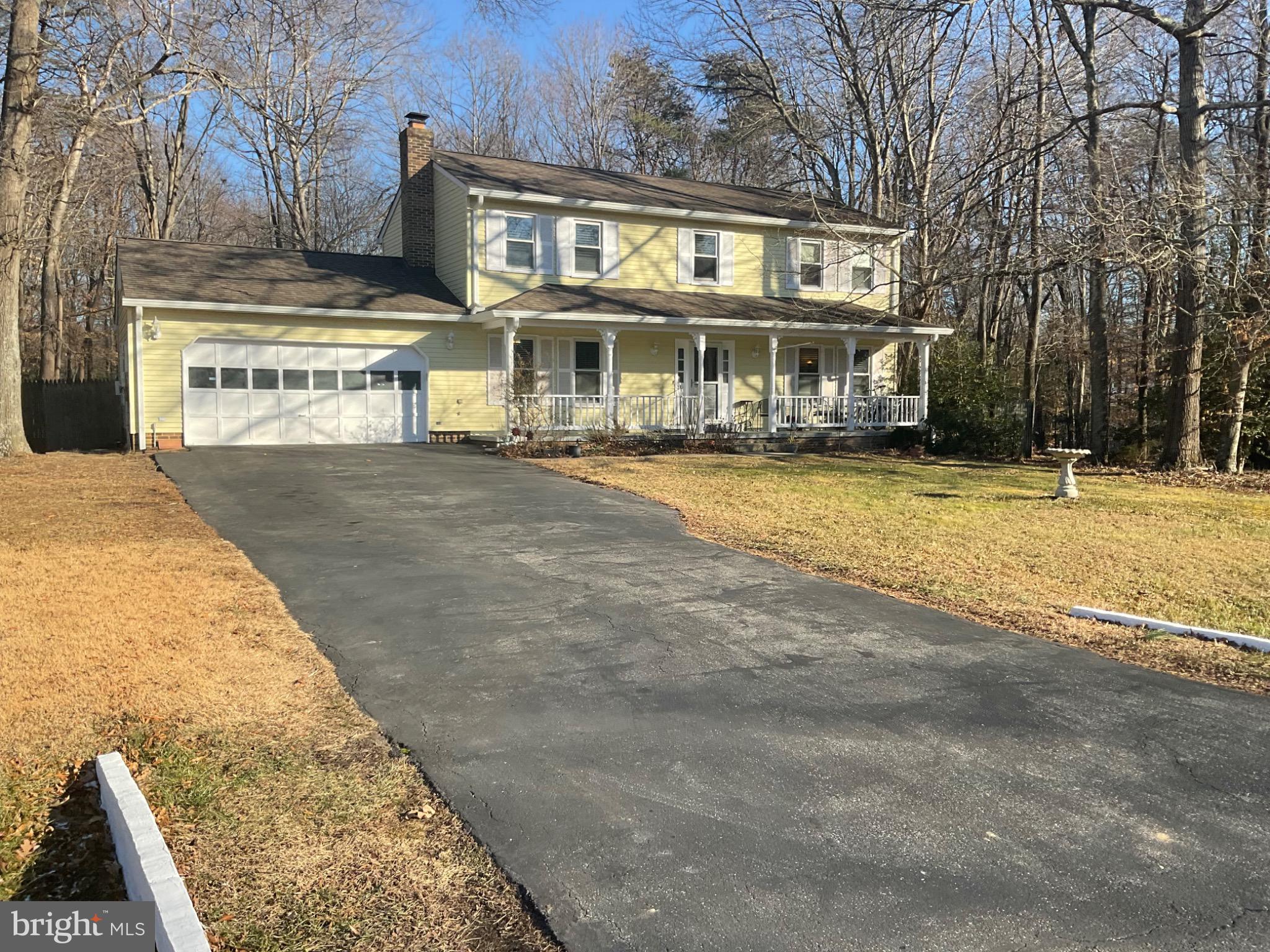 8555 Ridge Court Waldorf, MD 20603 - Photo 2 of 2 Charming yellow home nestled in nature.