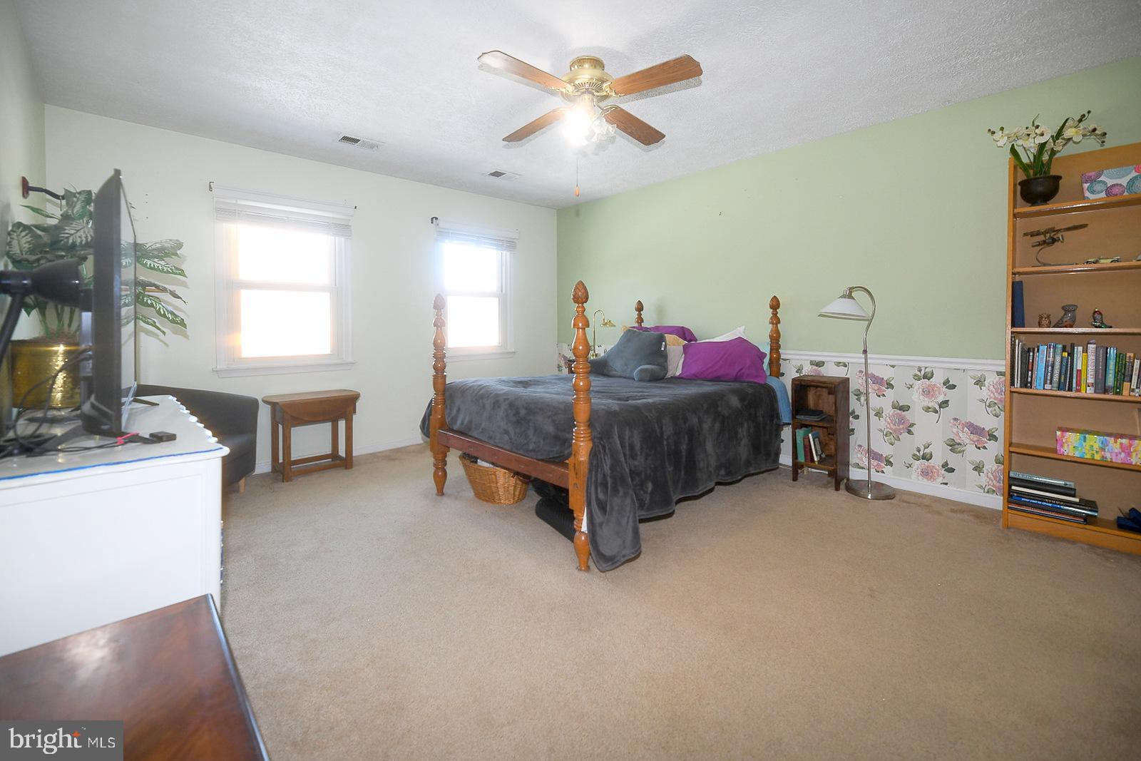 8555 Ridge Court Waldorf, MD 20603 - Photo 21 of 39 Cozy bedroom with natural light and charm.