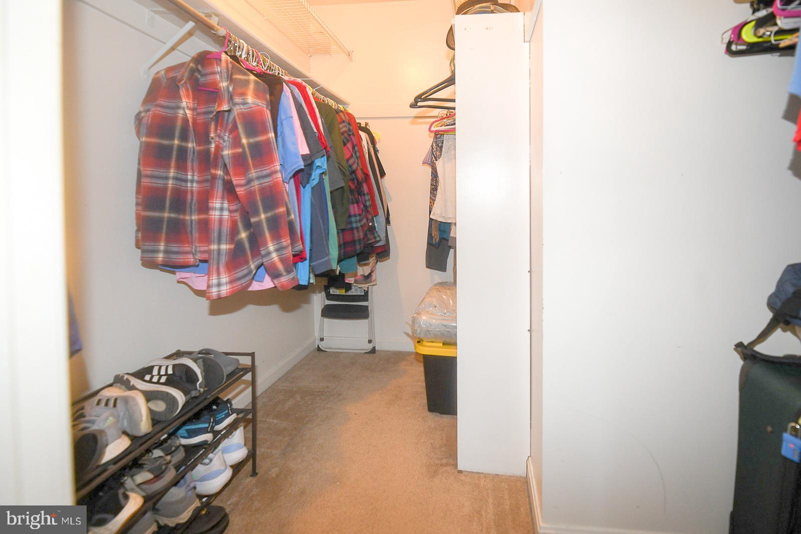 8555 Ridge Court Waldorf, MD 20603 - Photo 25 of 39 Spacious closet with organized clothing racks.