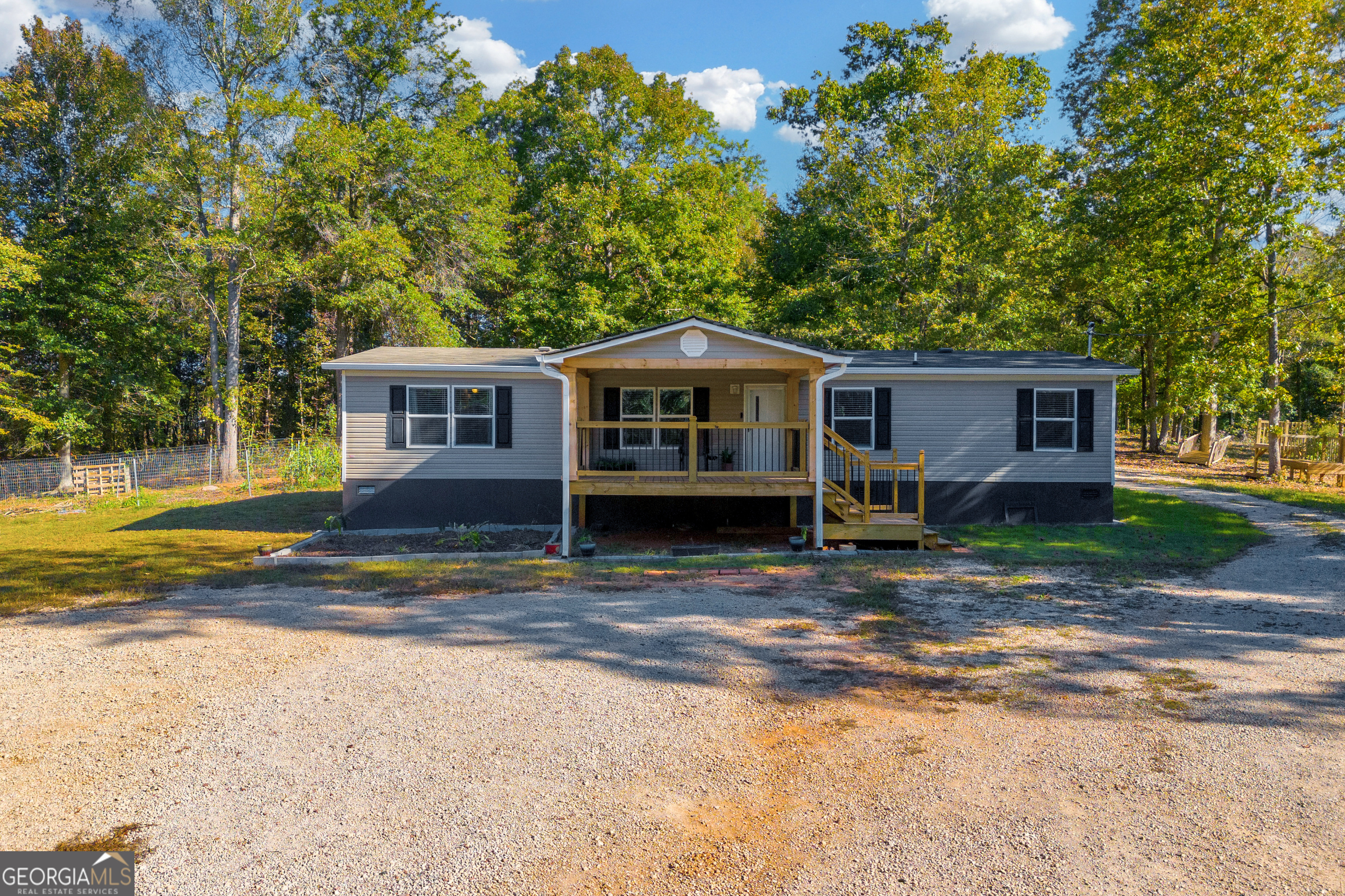 593 Duncan Swindle Road Commerce, GA 30530 - Photo 1 of 1 a view of a house with a yard and large trees