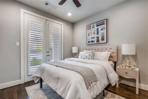 a bedroom with a large bed and a window