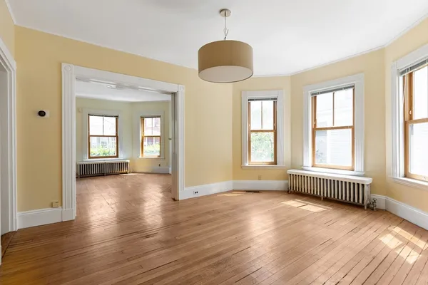 a view of livingroom with furniture wooden floor and windows