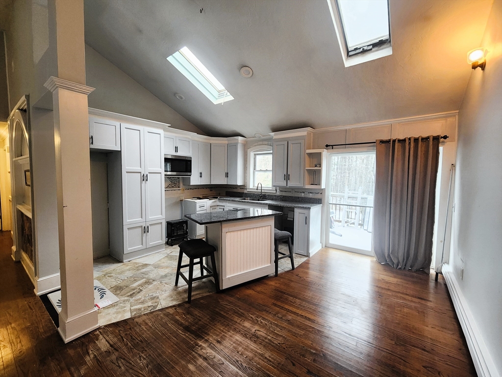 204 Lower Gore Road Webster, MA 01570 - Photo 6 of 36 a kitchen with a refrigerator and a stove top oven