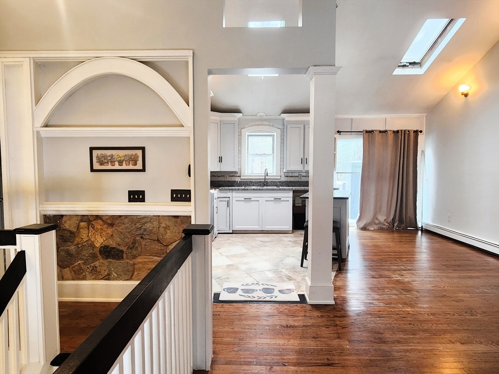 204 Lower Gore Road Webster, MA 01570 - Photo 7 of 36 a view of a kitchen with a sink and wooden floor
