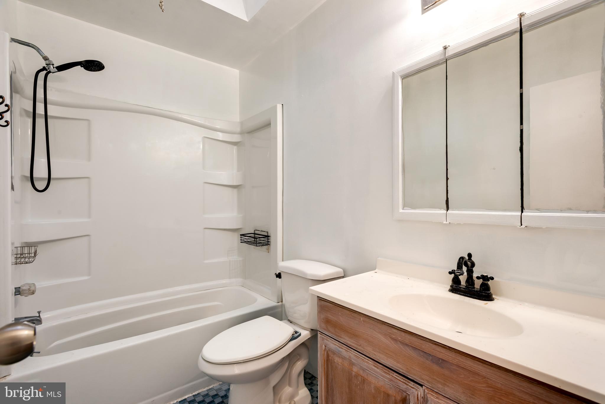 8601 Jackson Street Philadelphia, PA 19136 - Photo 17 of 33 a bathroom with a sink a toilet and a bathtub