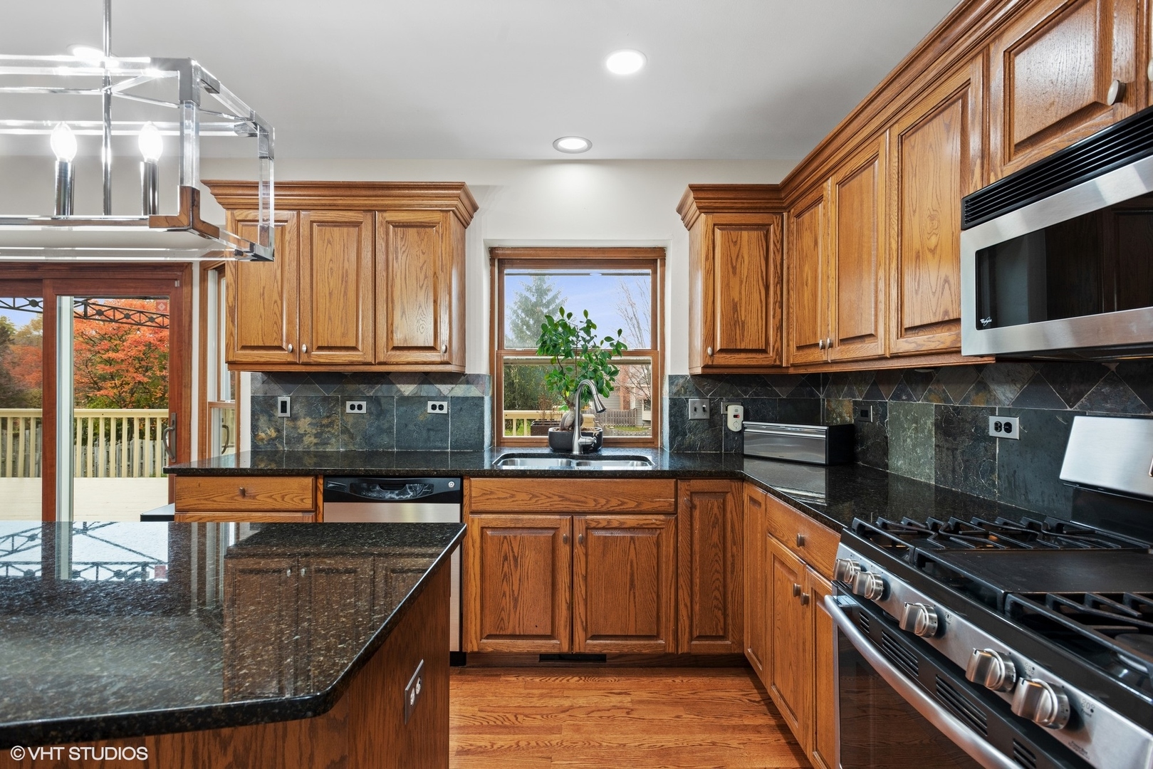601 Partridge Drive West Chicago, IL 60185 - Photo 15 of 39 a kitchen with stainless steel appliances granite countertop a stove a sink and a microwave