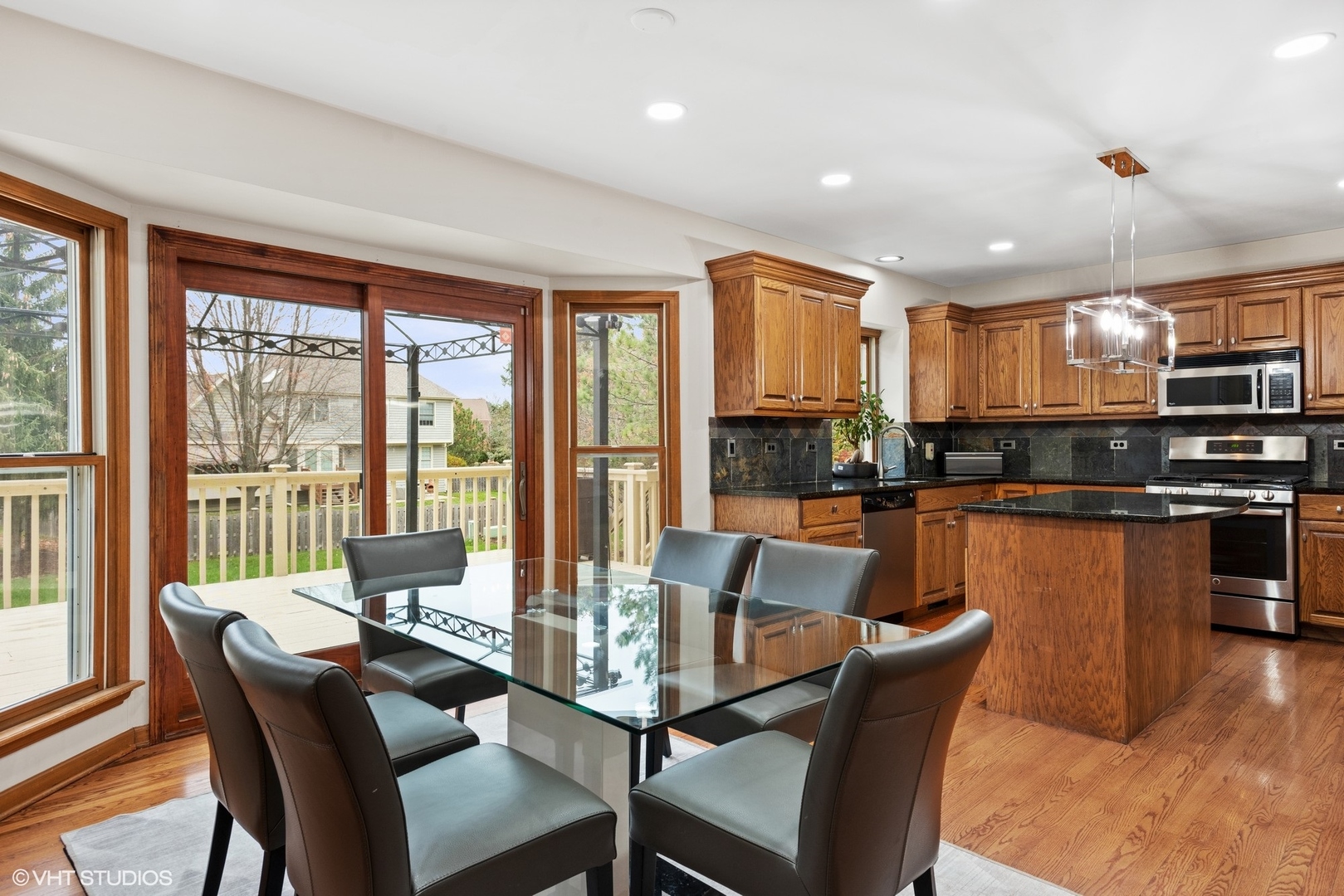 601 Partridge Drive West Chicago, IL 60185 - Photo 17 of 39 a view of a dining room with furniture large windows and wooden floor
